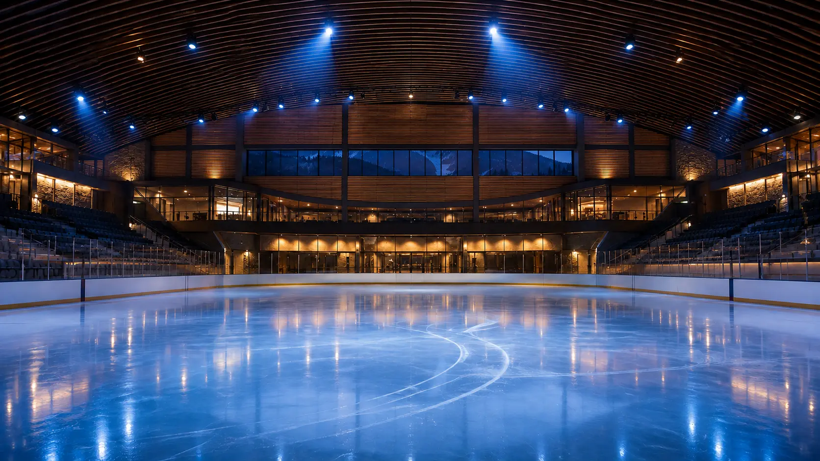 Conceptual interior view of the renewed Dobson Arena with a restrained mountain-facing clerestory, wood roof and illuminated ice